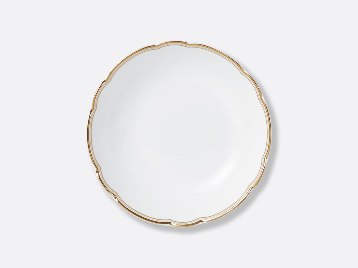 The Pompadour plate by Bernardaud is a round white porcelain piece with a scalloped edge and thin gold rim, shown from above on a light gray background, evoking classic Limoges France style.