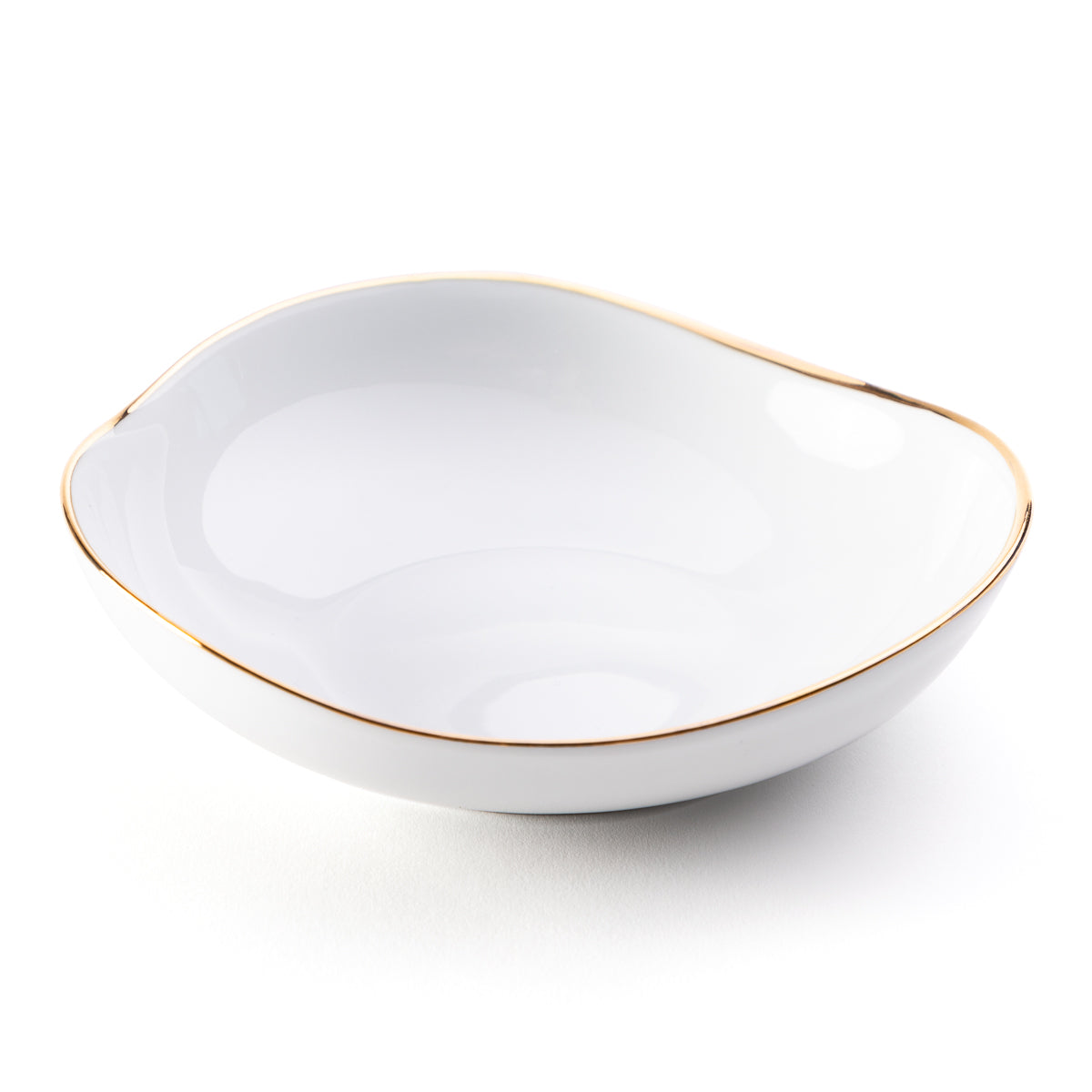 The Molecot Simply Gold Dinnerware features a white Limoges porcelain bowl with a slightly irregular shape and thin gold rim—an elegant addition to your handcrafted dining set.