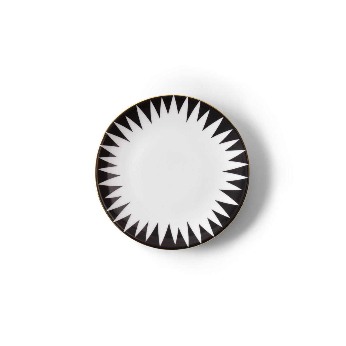 The Molecot Punk Dinnerware round white Limoges porcelain plate features a black and white geometric starburst rim and a thin gold edge, shown from above on a plain white background.