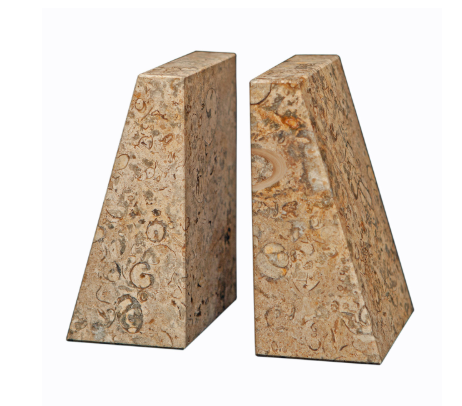 The Zeus Bookend Set by Designs by Marble Crafter features two upright, trapezoid-shaped sculptural bookends crafted from fossil stone in a beige and brown marbled pattern, displayed side by side on a white background.