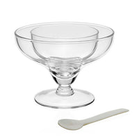 The William Yeoward Caspia Seafood/Caviar Server with Spoon features a clear glass bowl with a wide rim and short stem, ideal for serving shrimp cocktail or caviar, shown beside a small white spoon on a plain white background.