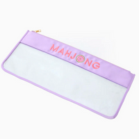 The Oh My Mahjong Tile Bag is a rectangular, lavender zippered bag featuring a transparent bottom and bold pink "MAHJONG" lettering across the top.
