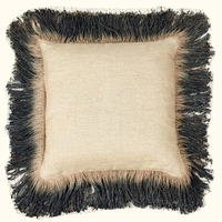 The Threads Soft Goods Jute Hand Dyed Fringe Pillow Carbon is a square beige pillow with textured linen fabric and thick black and beige fringe trim, shown against a plain background.