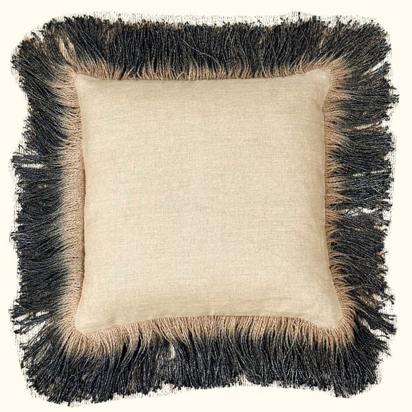The Threads Soft Goods Jute Hand Dyed Fringe Pillow Carbon is a square beige pillow with textured linen fabric and thick black and beige fringe trim, shown against a plain background.