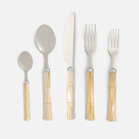 The Blue Pheasant Lulu Flatware 5 Piece Setting in Ivory features bamboo-style acrylic handles and stainless steel heads: teaspoon, tablespoon, knife, dinner fork, and salad fork shown side by side on a light gray background.