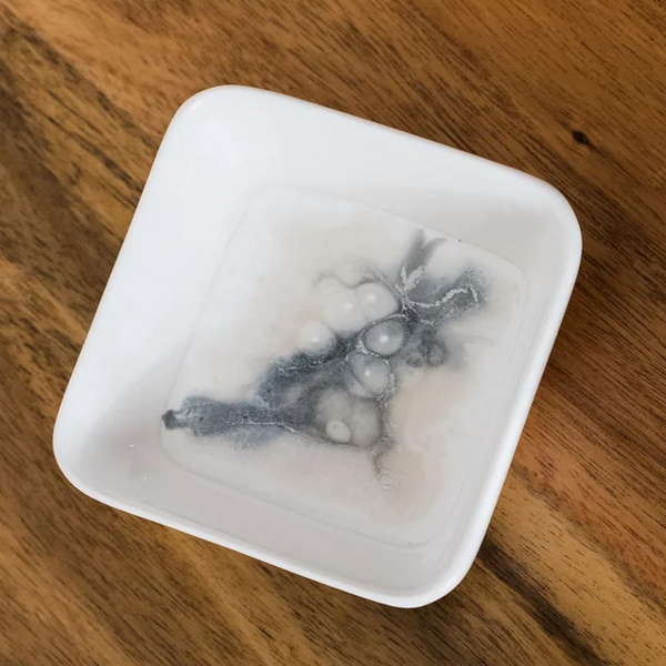 The Lynn & Liana Serveware Painted Dip Bowl - Marble features a swirling abstract design in white, cream, and dark gray—an elegant accent that beautifully complements unique serving bowls or resin accent bowls on your table.