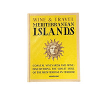 Assouline’s Wine & Travel Mediterranean Islands is a yellow book with a sun face illustration, exploring coastal vineyards and the essence of Mediterranean Islands wine.