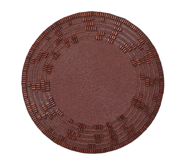 The Kim Seybert Wood Matrix Placemat Brown Set of 4 features round, brown handcrafted placemats with detailed concentric patterns and rectangular bead accents creating a subtle geometric edge, shown on a white background.