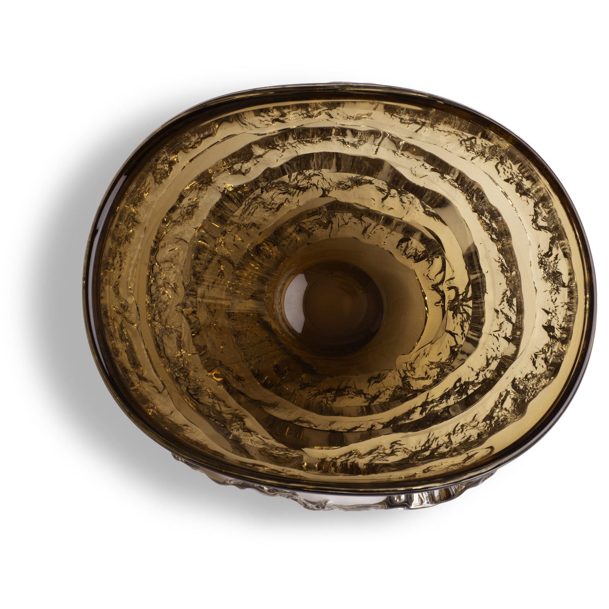 The Modena Amber Bowl by FlowDecor Inc. is a round decorative piece with concentric textured rings and a smooth, reflective center—its amber hue and sculptural design make it a striking accent for any space.