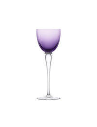 A Saint-Louis/Hermes Amadeus Hock Stemware glass features a tall stem and a subtly purple-tinted bowl, set against a plain white background.