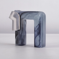The Chai Sculpture by CDMX / BRUCI is a handmade abstract resin piece from Mexico, featuring geometric angular forms in translucent blue and gray with a smooth finish and frosted details, shown against a plain white background.