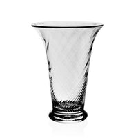 The William Yeoward Waves Flower Vase is a clear handmade crystal vase with a flared opening, subtle swirling pattern, and round base, shown against a plain white background.
