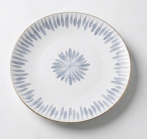 The Marie Daâge Allee de Cypres 4 plate by Marie Daâge is a white ceramic piece with a thin gold rim and blue-gray leaf motifs, showcasing luxury tableware and timeless hand painted dinnerware artistry.