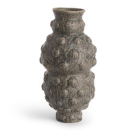 The Tobias Vase by FlowDecor Inc. is a gray ceramic vase with a narrow neck and base, featuring a bulbous, textured body with raised bumps. This contemporary piece stands upright on a white background.