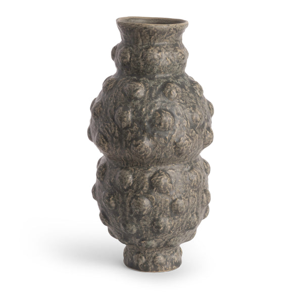 The Tobias Vase by FlowDecor Inc. is a gray ceramic vase with a narrow neck and base, featuring a bulbous, textured body with raised bumps. This contemporary piece stands upright on a white background.