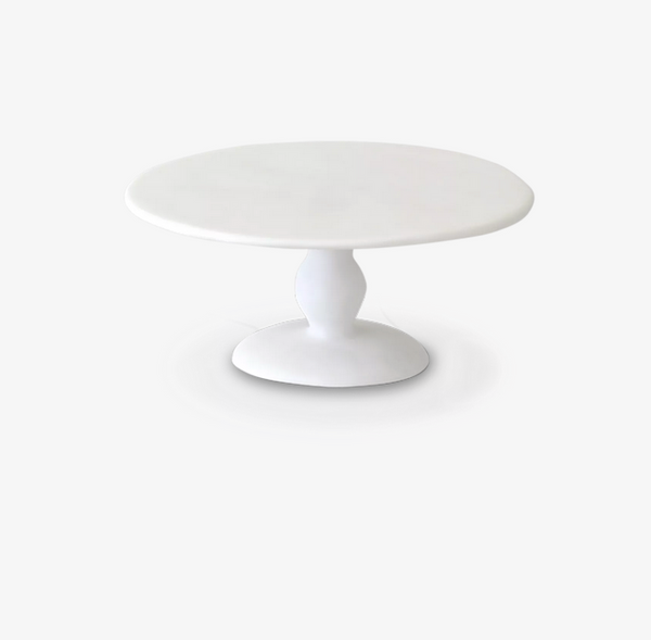 The TF Pedestal Cake Stand White - Large by Tina Frey features a smooth, round white surface and a sturdy central support on a circular base, shown against a plain white background.