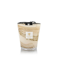 The Baobab Sand Siloli Candle is a hand-blown glass candle with beige and brown marbled patterns, a signature label, black ribbon accent, and an invigorating citrus fragrance.