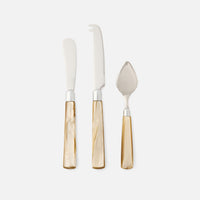 The Blue Pheasant Colson Cheese Knives Set of 3 features beige marbled handles and includes a cheese spreader, fork-tipped knife, and pointed cheese knife. Arranged upright on a white background, these knives are dishwasher safe.