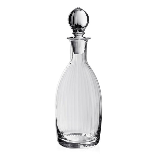 The Corinne Decanter and Stopper by William Yeoward features a Jazz Age-inspired design with vertical ridges, a round base, long neck, and matching stopper—a sophisticated glassware piece for any setting.
