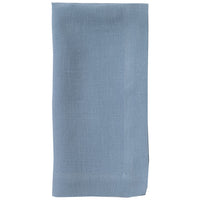 The Riviera Napkin Set of 4 by Bodrum features neatly folded, rectangular light blue stone-washed linen napkins with visible stitched borders, displayed on a white background.