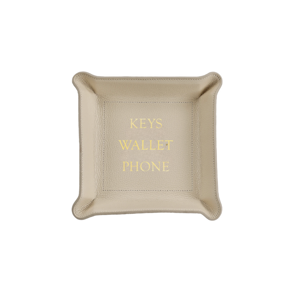 The Leather Valet Tray - Keys Wallet Phone by Graphic Image is a light beige leather catchall with KEYS, WALLET, and PHONE embossed in gold, providing a stylish way to organize your essentials.