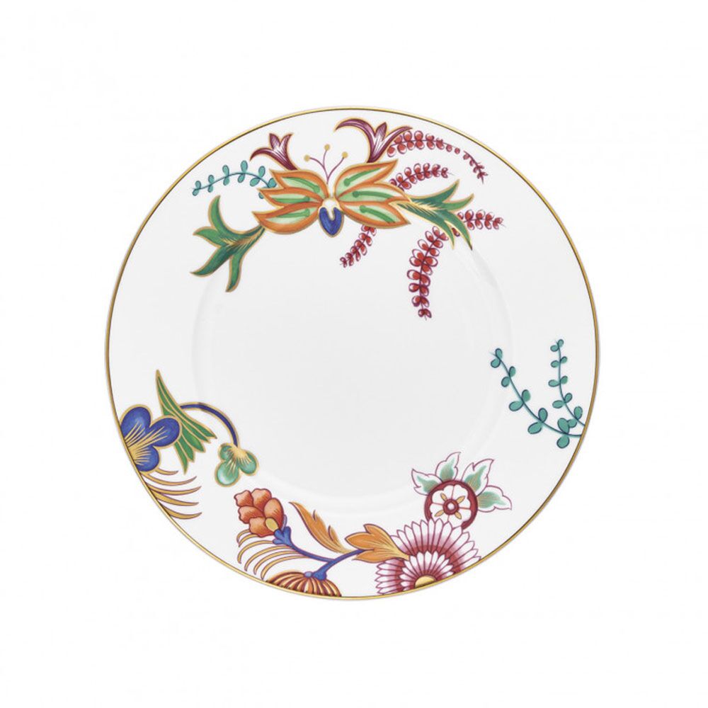 Raynaud Imari dinner plate in white porcelain featuring hand-painted Japanese floral art, finished with a thin gold rim and asymmetrical colorful patterns.