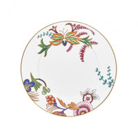 Raynaud Imari dinner plate in white porcelain featuring hand-painted Japanese floral art, finished with a thin gold rim and asymmetrical colorful patterns.