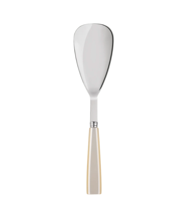 The Sabre Icone Rice Spoon - Pearl features a wide, flat, teardrop-shaped blade and a cream-colored handle—ideal for matching with similar flatware or pearled handle cutlery sets.