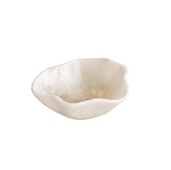 The Beatriz Ball Resin Alabaster Mini Bowl is a small, off-white sculptural vessel with an irregular shape and textured wavy rim, shown against a plain white background.