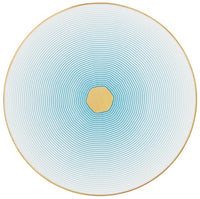 The Aura Dinnerware by Raynaud features a circular plate adorned with concentric turquoise lines radiating from a gold center, fading to white at the edge and finished with a slim gold rim for a modern touch.