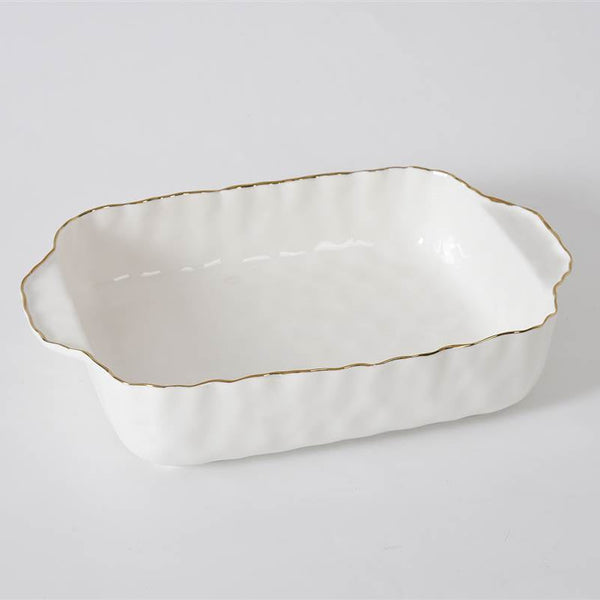 The PAMPA BAY Portofino Rectangle Baker 11 x 9 is a white porcelain baking dish with scalloped edges, gold trim, and handles on both short sides, shown on a plain light background. It is oven safe.