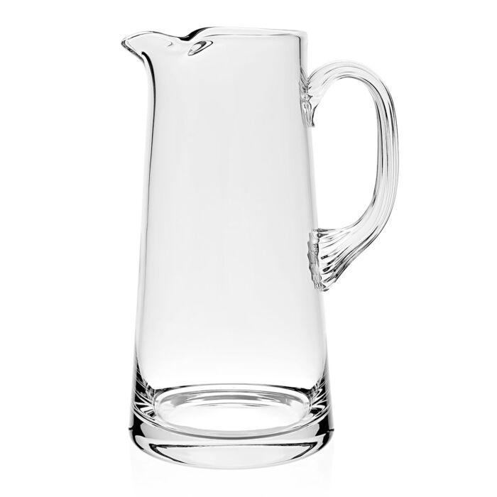 The Fanny Pitcher by William Yeoward features a tall, slender clear design with a graceful handle—ideal as a decorative jug or an elegant wedding gift.