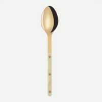 The Sabre Bistro Horn Serving Spoon, made in France, features a reflective stainless steel bowl and a white handle with three gold rivets, shown on a plain white background.
