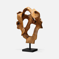 The Marcianus Sculpture Teak 20" by Made Goods features organic, abstract curves and holes, mounted on a black rectangular base—an eye-catching handmade contemporary piece set against a plain white background.