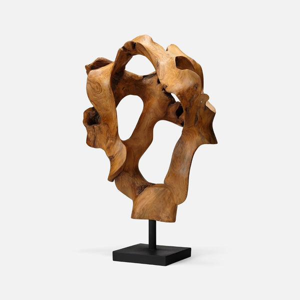 The Marcianus Sculpture Teak 20" by Made Goods features organic, abstract curves and holes, mounted on a black rectangular base—an eye-catching handmade contemporary piece set against a plain white background.