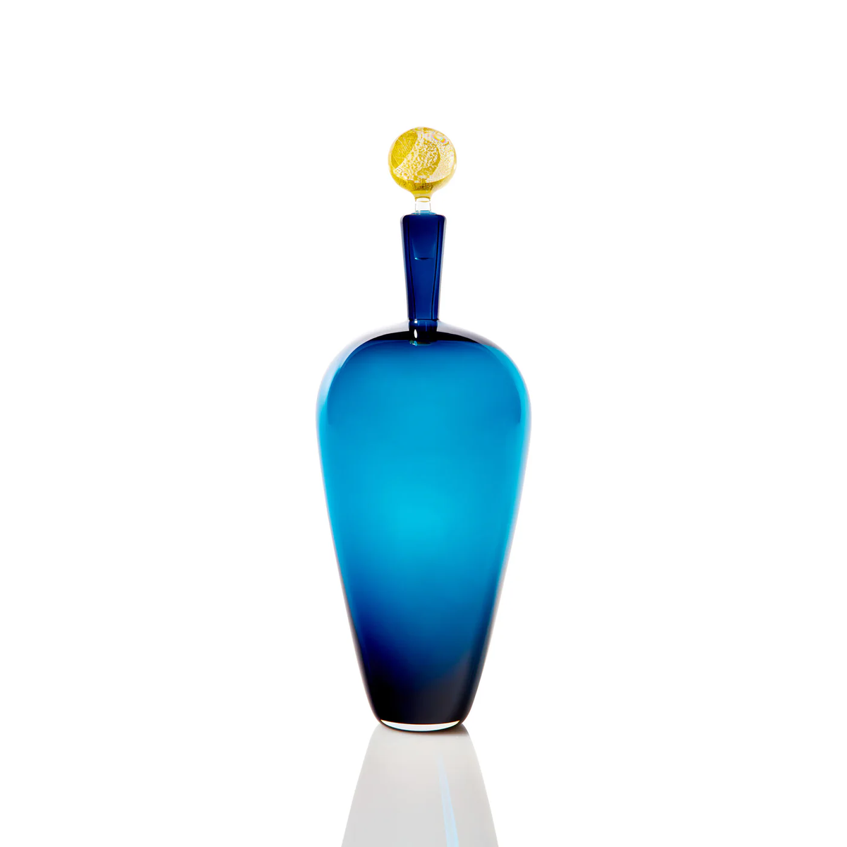 The Cariati Carmella Decanters Steel Blue & Gold features an elegant tall blue glass body, a narrow neck, and a 24K gold textured spherical stopper, displayed against a white background.