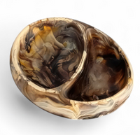 The Nashi Home Arila Split Bowl - Mocha features two round sections and a marble-like swirl pattern in brown, beige, cream, and black on white.