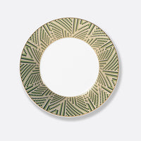 The Augusta Dinnerware plate by Bernardaud is round Limoges porcelain with a wide rim, showcasing an Art Deco geometric pattern in green, black, and gold, a plain white center, and a metallic gold edge.