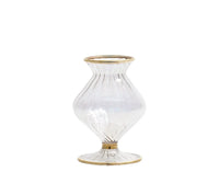 The Kim Seybert Scallop Bud Vase - Clear is a mouth-blown glass vase featuring a fluted, bulbous silhouette and a wide opening, accented with elegant 18K gold detailing on the rim, base, and middle. Inspired by the classic Scallop Bud Vase design, it is finished with a flat, round base for enhanced stability.
