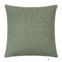 The Decor Fifty-Five Angelina Pillow Forest is a square, boucle-textured green accent pillow with a curly surface, shown against a plain white background.