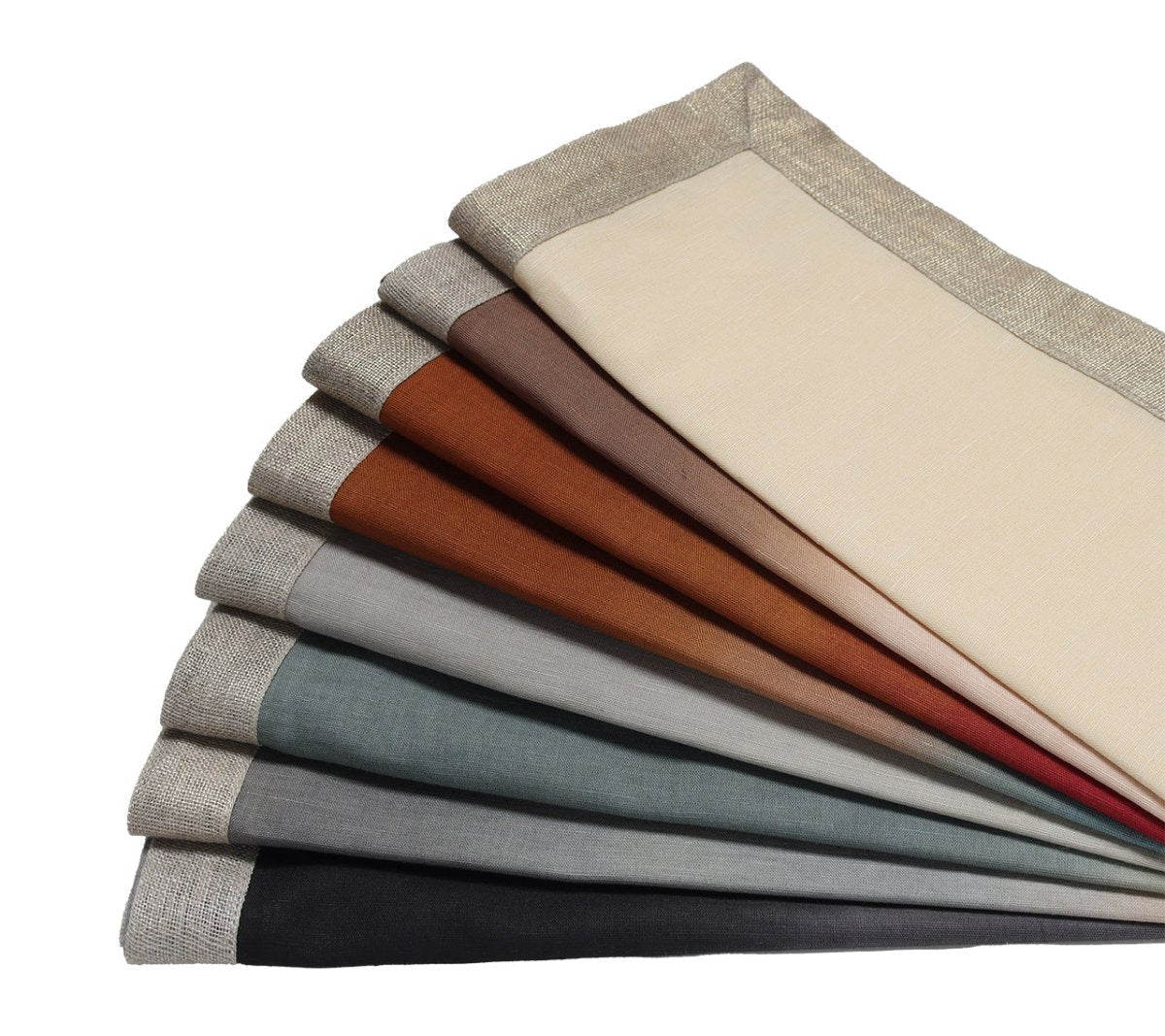 The Kim Seybert Dip Dye Napkins - Earthtones, set of 4, features linen napkins in a spectrum of earth-inspired colors with beige borders, including cream, brown, rust tones and shades of grey, blue, and black.