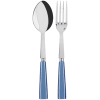 The Sabre Icone Serving Set features a metal spoon and fork with shiny surfaces and blue handles, displayed side by side on a light background to highlight the sleek design of this modern cutlery.