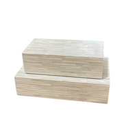 Two Pearly Geometric Boxes by Bojay, featuring a light woodgrain striped pattern, are stacked on top of each other against a white background, creating elegant decorative accents that also offer functional storage solutions.