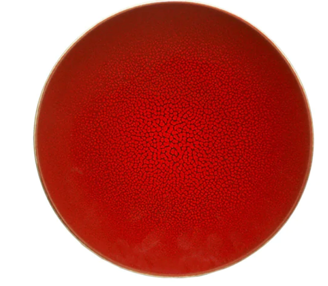 The Tourron Dinnerware Cerise plate by Jars - Rosenthal features a vibrant red, crackled center, a thin light brown rim, and a mosaic-like ceramic texture. The round plate is photographed from above against a white background.