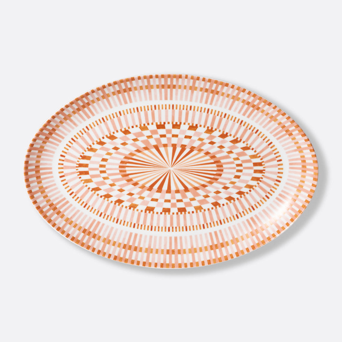The Bernardaud Terra Rosa Dinnerware round plate features an orange and white geometric design with concentric circles and radiating lines. Made in Limoges, France.