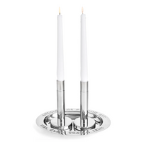 The Godinger Shabbat Tray with Candlesticks features two lit white tapers in modern silver holders on an engraved tray, perfect for elegant Shabbat celebrations.