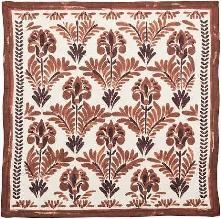 The Kim Seybert Botanica Napkin Ivory & Brown Set of 4 features a square textile with a brown and maroon floral pattern on cream, finished with a matching border—ideal for autumn table settings.