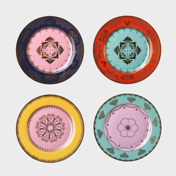 The Polspotten Grandpa Canape Plates Multi Set of 4 includes porcelain side plates with unique central designs: navy/pink (top left), red/light blue (top right), yellow/pink (bottom left), and turquoise/lilac (bottom right).