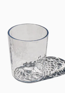 The TarHong Provincial DOF - Clear 14.6oz glass sits empty on a white surface, its shatterproof acrylic catching light and casting rippled, wavy shadows.