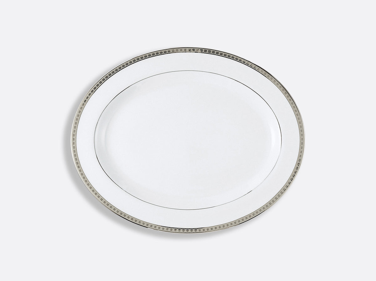 A Bernardaud Athena Platinum Dinnerware plate with a silver rim, viewed from above on a light gray background.